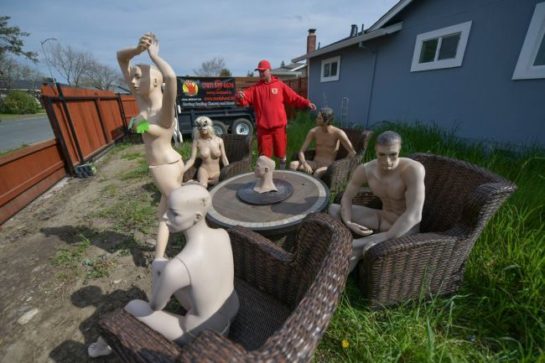 Man displays naked mannequins on front lawn after fence 